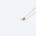Minimalist golden necklace with a black square pendant featuring the letter G design - Letter G