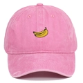 Pink washed cotton baseball cap featuring yellow banana fruit embroidery on the front - Pink