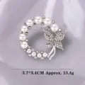Silver bow butterfly ring brooch with pearls and rhinestones on silk background - Xd11446-3