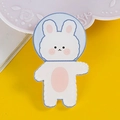 Cute white acrylic rabbit pin badge with light blue circle background on yellow surface - 12 Waving Rabbit