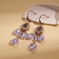 Vintage bohemian drop earrings with purple beads and tassel detail on textured background - Ear Hook-Purple