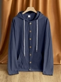 Detail view of the buttoned neckline and fabric texture of this navy linen hooded shirt - Navy Blue