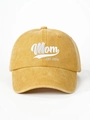 Detailed close-up of white Mom EST 2026 embroidery on mustard yellow washed cotton cap - Yellow