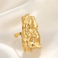 Detailed close-up of a gold hammered rectangular ring on elegant white silk background - Irregular Hammered / Gold