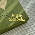 Close-up of golden acrylic Merry Christmas cake topper on an elegant gift box - Merry Christmas Style 3 / 1.3mm / Gold