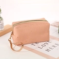 Pink orange star-patterned makeup bag with golden zipper and leather wristlet strap - Orange