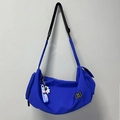 Royal blue nylon crescent bag with adjustable strap and astronaut charm detail - Blue + Astronaut