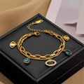 Golden double-layer evil eye bracelet with blue drop charm on a jewelry box - A【5157】Eye Bracelet Gold