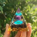 Orgone pyramid with amethyst sphere, black tourmaline, flower of life and gold foil detail - Style 15