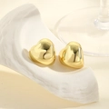 Elegant gold heart-shaped stud earrings with polished mirror finish on stone - Gold 3D Heart