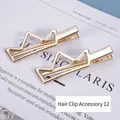 Set van twee gouden geometrische kroon haarspelden met gepolijste afwerking en krokodillenklem - Nr. 12 Accessoire haarspeld