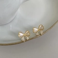 Elegant gold bow earrings with cat eye stone and micro-paved crystals on ceramic edge - 18K Gold Bowknot Style