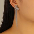 Detailed view of silver petal earrings with long tassel snake chains worn by a model - 3D Petal Tassel (8796)