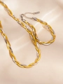 Detail of woven stainless steel chain necklace in gold and silver tones on silk - Two-tone Necklace