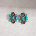 Détails de boucles d'oreilles vintage en or avec résine turquoise et strass brillants - Boucles d'oreilles bleues
