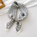 Elegant 70cm white silk scarf with blue horse bit print tied in a stylish loop knot - Black Grey Horse