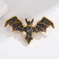 Gothic bat brooch with purple and black rhinestones on a gold alloy frame - Black