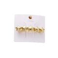 Golden star shaped zinc alloy hair clip for women displayed on a white card - Gold Liquid Star