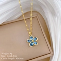 Detailed close-up of a rotating blue petal flower necklace on jewelry box with product specs - Blue Rotating Flower (H229)