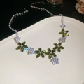 Macro view of floral necklace with green marquise stones and sparkling white zircons - 26# Necklace-Silver-Green-Irregular Flower