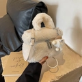 Chic beige faux shearling crossbody bag with cute monster charm and top handle - With Pendant / White