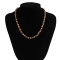 Detail of bohemian beaded necklace for men featuring brown wooden beads on a black bust - 05940 Dark Brown Wood & Red-Brown Beads Mix