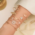 6-teiliges goldenes Armband-Set mit rosa Steinen und Strass am Handgelenk getragen - Gold Sechsteiliges Tropfen-Stern-Set (11310)