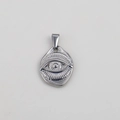 Golden stainless steel oval pendant featuring a mystical evil eye relief and flat bail - Steel-Evil Eye