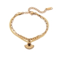 Detail of gold double-layer stainless steel bracelet featuring sun pendant and S. STEEL tag - Double Layer Bohemian Style Pendant (31990) / Gold