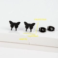 Macro detail of matte black butterfly stud earrings with dimensions 1cm x 0.8cm and 2g weight - Butterfly / Black
