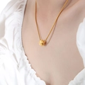 Chic golden bead pendant necklace with box chain for women on a model's neck - 64cm / Gold Necklace