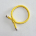Close-up of bright yellow braided elastic hair tie with silver alloy metal fasteners - Yellow