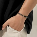 Rainbow gradient stainless steel Cuban chain bracelet on a model's wrist - Rainbow Cuban Chain / Rainbow