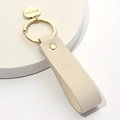 Beige leather heart keychain with gold ring and engraved He is Love charm accessory - Off White