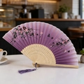 Classic folding fan with purple gradient silk, cherry blossom patterns, and purple tassel - Purple Sakura Butterfly