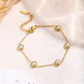 Minimalist gold titanium steel bracelet with five round white pearls in bezel setting - White Pearl Bracelet / Gold