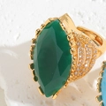 Macro shot of marquise-cut green emerald zircon ring with gold-plated vintage finish - Adjustable Open / Emerald