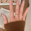 Vintage-style gold ring with marquise-cut red ruby and twisted band on a model's finger - Gold Twist Marquise Ruby Design Ring (J5767)