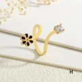 Close-up of gold open ring with purple enamel flower and sparkling cubic zirconia - Adjustable Open / Purple Flower