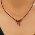 Burgundy bow pendant necklace on a sleek leather cord with a minimalist matte finish - KC Gold Wine Red Bow (3213)