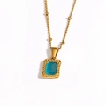 Detail of a vintage gold necklace with rectangular blue gemstone pendant and hammered texture - Blue Gemstone (Style 4)