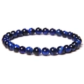 Macro shot of natural blue tiger eye stone beads with unique cat eye light effect - 6mm Royal Blue Tiger Eye