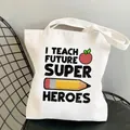 Detail of white canvas tote bag with I Teach Future Super Heroes print and pencil graphics - C5 Teacher Theme No Inner Pocket No Zipper