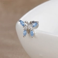 Macro view of butterfly cartilage stud earring with blue marquise cubic zirconia stones - Light Blue Butterfly