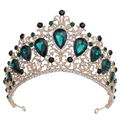 Detail of golden Baroque crown featuring green and black teardrop crystals on white background - KC Gold White Diamond + Green Diamond