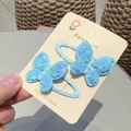 Close-up of light blue sequin butterfly hair clips with pearl beads on card - Blue BB Clip (Pair)