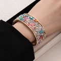 Golden wide open cuff bracelet with colorful crushed stones and sparkling diamonds - Colorful