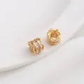 Macro shot of 14K gold-filled spacer beads with cubic zirconia and hollow lace design - 6# Tubular Barrel / 8x7mm / 14K Gold