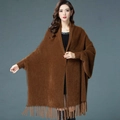 Detailed texture of brown faux mink velvet knit shawl featuring stylish tassel hemline - Coffee