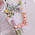Rose gold DIY charm bracelet with floral beads and heart pendant on floral backdrop - Rose Gold Floral Dreamcatcher Style (3#)